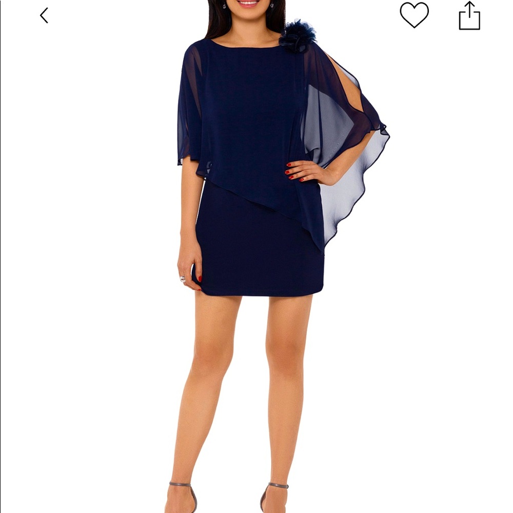 Sheerly chic, an asymmetrical overlay flows over the slim shape